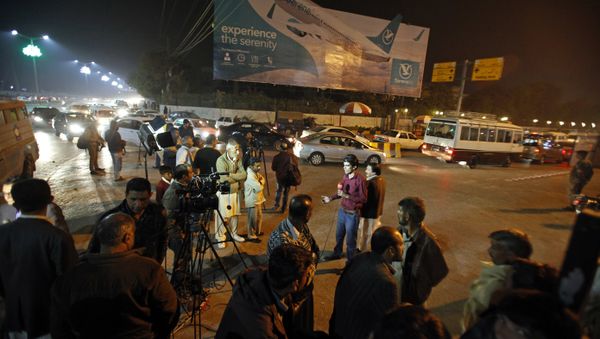 Pakistani media and residents gather at Benazir Bhutto International Airport following a report that a passenger plane from Chitral, in the country's north, had crashed near a village near the town of Havelian, in Islamabad, Pakistan Pakistani media and residents gather at Benazir Bhutto International Airport following a report that a passenger plane from Chitral, in the country's north, had crashed near a village near the town of Havelian, in Islamabad, Pakistan - Sputnik International