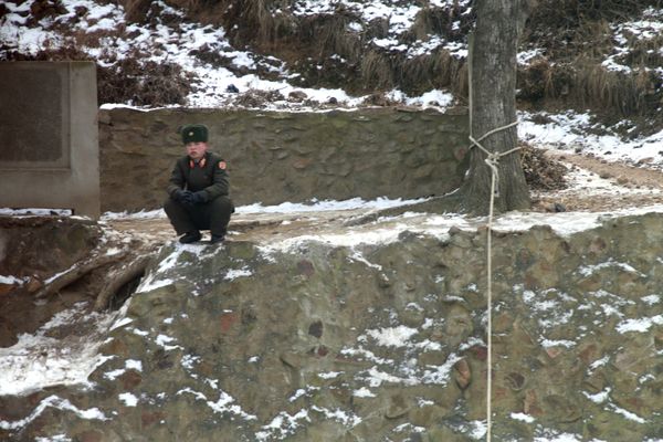 A North Korean soldier keeps watch across the river. A North Korean soldier keeps watch across the river. - Sputnik International