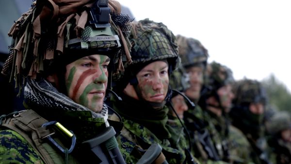 Lithuanian troops along with the other troops from 11 NATO nations take part in the exercise in urban warfare during Iron Sword exercise in the mock town near Pabrade, Lithuania, December 2, 2016. Lithuanian troops along with the other troops from 11 NATO nations take part in the exercise in urban warfare during Iron Sword exercise in the mock town near Pabrade, Lithuania, December 2, 2016. - Sputnik International