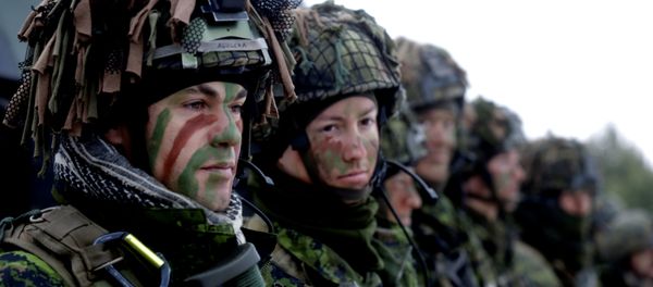 Lithuanian troops along with the other troops from 11 NATO nations take part in the exercise in urban warfare during Iron Sword exercise in the mock town near Pabrade, Lithuania, December 2, 2016. Lithuanian troops along with the other troops from 11 NATO nations take part in the exercise in urban warfare during Iron Sword exercise in the mock town near Pabrade, Lithuania, December 2, 2016. - Sputnik International