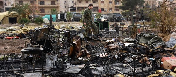 A Russian soldier inspects the damage at a field hospital that was destroyed by rebel shelling on December 5, 2016 in the Furqan neighbourhood of the government-held side of west Aleppo. A Russian soldier inspects the damage at a field hospital that was destroyed by rebel shelling on December 5, 2016 in the Furqan neighbourhood of the government-held side of west Aleppo. - Sputnik International