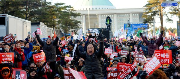 People react after impeachment vote on South Korean President Park Geun-hye was passed, in front of the National Assembly in Seoul, South Korea, December 9, 2016. The sign reads Impeach Park Geun-hye. - Sputnik International