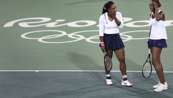 Venus Williams, of the United States, right, talks with her sister Serena after losing a point in a doubles match against Lucie Safarova and Barbora Strycova, of the Czech Republic, at the 2016 Summer Olympics in Rio de Janeiro, Brazil Venus Williams, of the United States, right, talks with her sister Serena after losing a point in a doubles match against Lucie Safarova and Barbora Strycova, of the Czech Republic, at the 2016 Summer Olympics in Rio de Janeiro, Brazil - Sputnik International