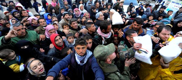 Syrians evacuated from eastern Aleppo, reach out for Russian food aid in government controlled Jibreen area in Aleppo, Syria November 30, 2016. Syrians evacuated from eastern Aleppo, reach out for Russian food aid in government controlled Jibreen area in Aleppo, Syria November 30, 2016. - Sputnik International