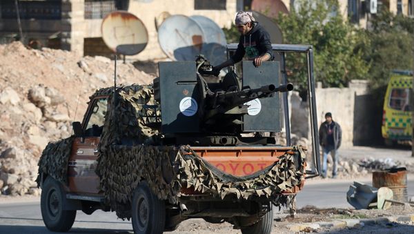 A rebel fighter stands on a pick-up truck mounted with a weapon in a rebel-held area of Aleppo, Syria December 9, 2016 A rebel fighter stands on a pick-up truck mounted with a weapon in a rebel-held area of Aleppo, Syria December 9, 2016 - Sputnik International