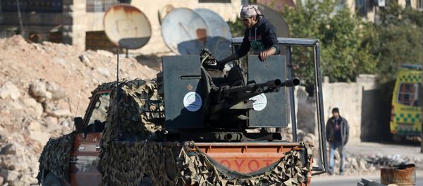 A rebel fighter stands on a pick-up truck mounted with a weapon in a rebel-held area of Aleppo, Syria December 9, 2016 A rebel fighter stands on a pick-up truck mounted with a weapon in a rebel-held area of Aleppo, Syria December 9, 2016 - Sputnik International