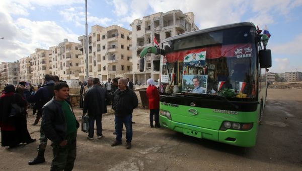Syrians, from various western districts, wait at the Razi bus stop in Aleppo's central Jamiliyeh neighbourhood before taking part in a bus trip through government-held territory between the two sides of the divided city on December 3, 2016 as the pro-government forces seized 60 percent of the former rebel stronghold in east Aleppo Syrians, from various western districts, wait at the Razi bus stop in Aleppo's central Jamiliyeh neighbourhood before taking part in a bus trip through government-held territory between the two sides of the divided city on December 3, 2016 as the pro-government forces seized 60 percent of the former rebel stronghold in east Aleppo - Sputnik International