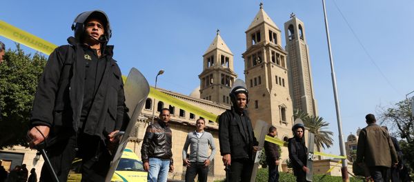 Members of the special police forces stand guard to secure the area around St. Mark's Coptic Orthodox Cathedral after an explosion inside the cathedral in Cairo, Egypt December 11, 2016 - Sputnik International