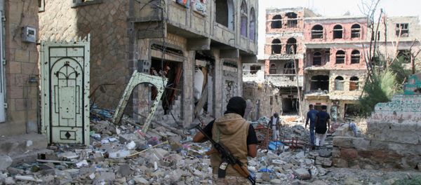 A pro-government fighter walks at the site of recent battles between Houthi fighters and pro-government troops , on the second day of a 48-hour ceasefire in the southwestern city of Taiz, Yemen November 20, 2016 A pro-government fighter walks at the site of recent battles between Houthi fighters and pro-government troops , on the second day of a 48-hour ceasefire in the southwestern city of Taiz, Yemen November 20, 2016 - Sputnik International