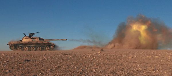 This image posted online on Dec. 10, 2016, by Daesh supporters on an anonymous photo sharing website, purports to show a tank operated by Daesh terrorists firing at Syrian troops east of Palmyra in Homs provence, Syria This image posted online on Dec. 10, 2016, by Daesh supporters on an anonymous photo sharing website, purports to show a tank operated by Daesh terrorists firing at Syrian troops east of Palmyra in Homs provence, Syria - Sputnik International