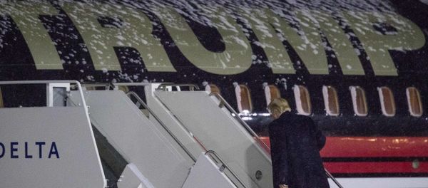 President-elect Donald Trump boards his plane at Gerald R. Ford International Airport, Friday, Dec. 9, 2016, in Grand Rapids, Mich, after attending a rally President-elect Donald Trump boards his plane at Gerald R. Ford International Airport, Friday, Dec. 9, 2016, in Grand Rapids, Mich, after attending a rally - Sputnik International