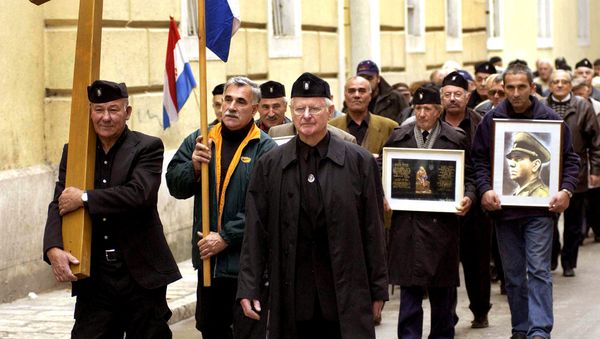 A group of mostly older Croatians, wearing Second World War Ustasha regime uniforms, parade in the Croatian Adriatic resort of Zadar, carrying a portrait of the late Ustasha leader, Ante Pavelic (R), 07 December 2004 - Sputnik International