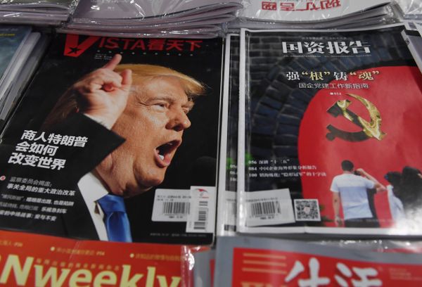 A magazine featuring US President-elect Donald Trump is seen at a bookstore in Beijing on December 12, 2016. The headline reads How will businessman Trump change the world A magazine featuring US President-elect Donald Trump is seen at a bookstore in Beijing on December 12, 2016. The headline reads How will businessman Trump change the world - Sputnik International