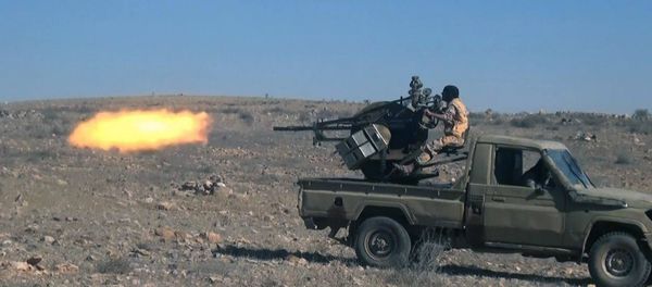 This image posted online on Dec. 10, 2016, by Daesh supporters on an anonymous photo sharing website, purports to show a gun-mounted vehicle operated by Daesh firing at Syrian troops, north of Palmyra This image posted online on Dec. 10, 2016, by Daesh supporters on an anonymous photo sharing website, purports to show a gun-mounted vehicle operated by Daesh firing at Syrian troops, north of Palmyra - Sputnik International