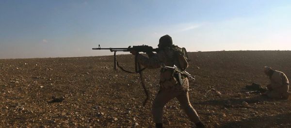 This image posted online on Saturday, Dec. 10, 2016, by supporters of the Islamic State militant group on an anonymous photo sharing website, purports to show a gunman firing at an unseen target, east of of Palmyra, east of Palmyra city, in Homs provence, Syria - Sputnik International