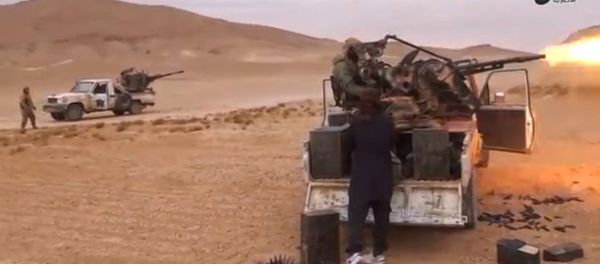 A still image taken on December 11, 2016 from a video released by Islamic State-affiliated Amaq news agency on December 10, 2016, purports to show Islamic State fighters advancing over the Hayan mountain south of Palmyra A still image taken on December 11, 2016 from a video released by Islamic State-affiliated Amaq news agency on December 10, 2016, purports to show Islamic State fighters advancing over the Hayan mountain south of Palmyra - Sputnik International