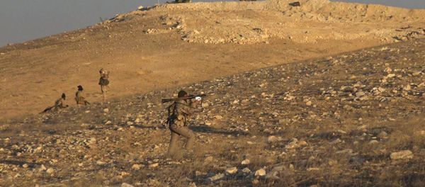 This image posted online on Saturday, Dec. 10, 2016, by supporters of the Islamic State militant group on an anonymous photo sharing website, shows gunmen with a shoulder-propelled weapon east of Palmyra city, in Homs Provence, Syria - Sputnik International