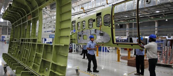 Indian workers assemble the cabin of a Sikorsky S-92 helicopter at a Tata Advanced Systems factory in Hyderabad, India, Monday, April 2, 2012 Indian workers assemble the cabin of a Sikorsky S-92 helicopter at a Tata Advanced Systems factory in Hyderabad, India, Monday, April 2, 2012 - Sputnik International