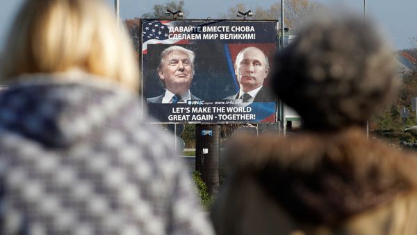 A billboard showing a pictures of US president-elect Donald Trump and Russian President Vladimir Putin is seen through pedesterians in Danilovgrad, Montenegro, November 16, 2016 A billboard showing a pictures of US president-elect Donald Trump and Russian President Vladimir Putin is seen through pedesterians in Danilovgrad, Montenegro, November 16, 2016 - Sputnik International