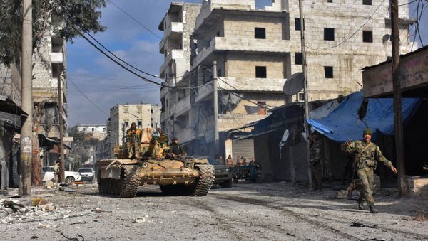 Syrian pro-government forces patrol Aleppo's eastern al-Salihin neighbourhood on December 12, 2016 after troops retook the area from rebel fighters - Sputnik International