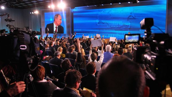 Russian President Vladimir Putin answers journalists' questions during the annual big conference at the International Trade Center in Krasnaya Presnya (File) - Sputnik International
