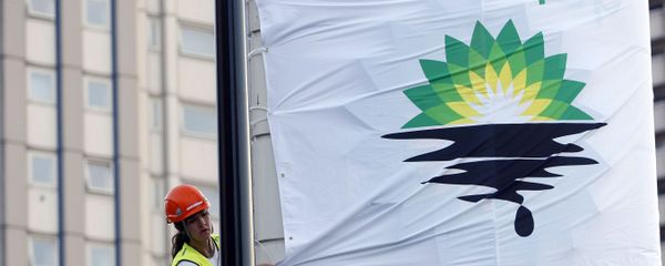 In this Tuesday, July 27, 2010, file photo, a Greenpeace activist puts up a banner as they block off a British Petroleum fuel station in protest as the BP board announce their annual results, in London In this Tuesday, July 27, 2010, file photo, a Greenpeace activist puts up a banner as they block off a British Petroleum fuel station in protest as the BP board announce their annual results, in London - Sputnik International