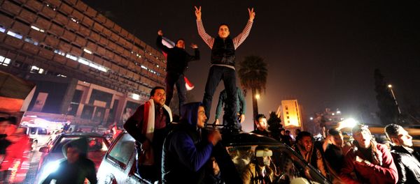 Supporters of Syria's President Bashar al-Assad carry their national flags and gesture as they tour the streets in celebration of what they say is the Syrian army's victory against the rebels in Aleppo, Syria December 12, 2016 Supporters of Syria's President Bashar al-Assad carry their national flags and gesture as they tour the streets in celebration of what they say is the Syrian army's victory against the rebels in Aleppo, Syria December 12, 2016 - Sputnik International