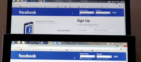 Computer screens display the Facebook sign-in screen in this photo illustration taken in Golden, Colorado, United States July 28, 2015 - Sputnik International