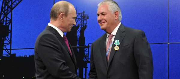 Vladimir Putin and Rex Tillerson - Sputnik International