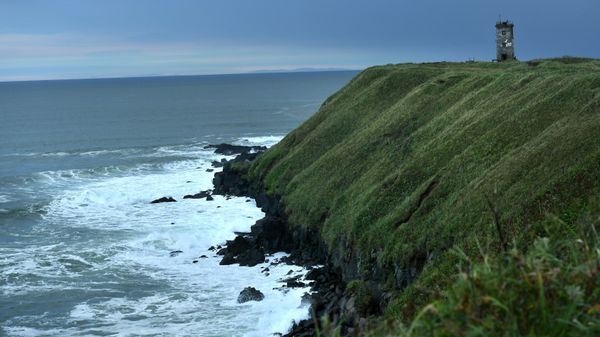 A lighthouse at the furthest end of the Yuzhno-Kurilsky cape on the Pacific coast on Kunashir Island of the Greater Kuril Ridge. - Sputnik International