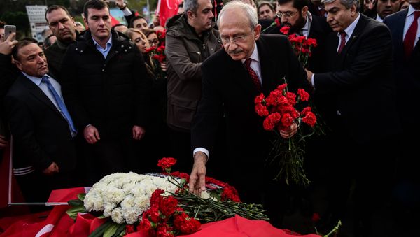 Kemal Kilicdaroglu (C), leader of the Republican People's Party (CHP), lays flowers at the scene of December 10 blasts outside the Vodafone Arena football stadium on December 14, 2016 in Istanbul Kemal Kilicdaroglu (C), leader of the Republican People's Party (CHP), lays flowers at the scene of December 10 blasts outside the Vodafone Arena football stadium on December 14, 2016 in Istanbul - Sputnik International