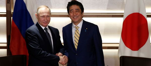 Russia's President Vladimir Putin (L) shakes hands with Japan's Prime Minister Shinzo Abe at the start of their summit meeting in Nagato, Yamaguchi prefecture, Japan, December 15, 2016. Russia's President Vladimir Putin (L) shakes hands with Japan's Prime Minister Shinzo Abe at the start of their summit meeting in Nagato, Yamaguchi prefecture, Japan, December 15, 2016. - Sputnik International