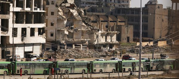 Buses are seen parked in Aleppo's government controlled area of Ramouseh, as they wait to evacuate civilians and rebels from eastern Aleppo, Syria December 15, 2016 Buses are seen parked in Aleppo's government controlled area of Ramouseh, as they wait to evacuate civilians and rebels from eastern Aleppo, Syria December 15, 2016 - Sputnik International