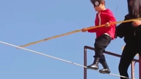 Five year old boy performed rope walk to earn a car for his family - Sputnik International