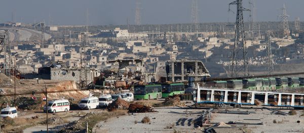 Ambulances and buses evacuating people drive out of a rebel-held part of Aleppo, Syria December 15, 2016. - Sputnik International