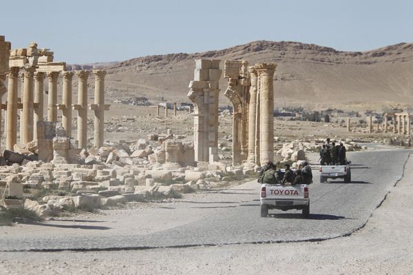 Syrian army soldiers drive past the Arch of Triumph in the historic city of Palmyra, in Homs Governorate, Syria. (File) Syrian army soldiers drive past the Arch of Triumph in the historic city of Palmyra, in Homs Governorate, Syria. (File) - Sputnik International