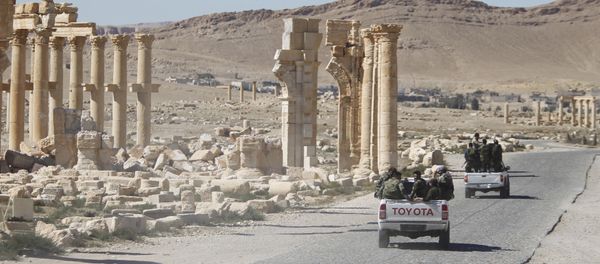 Syrian army soldiers drive past the Arch of Triumph in the historic city of Palmyra, in Homs Governorate, Syria. (File) Syrian army soldiers drive past the Arch of Triumph in the historic city of Palmyra, in Homs Governorate, Syria. (File) - Sputnik International