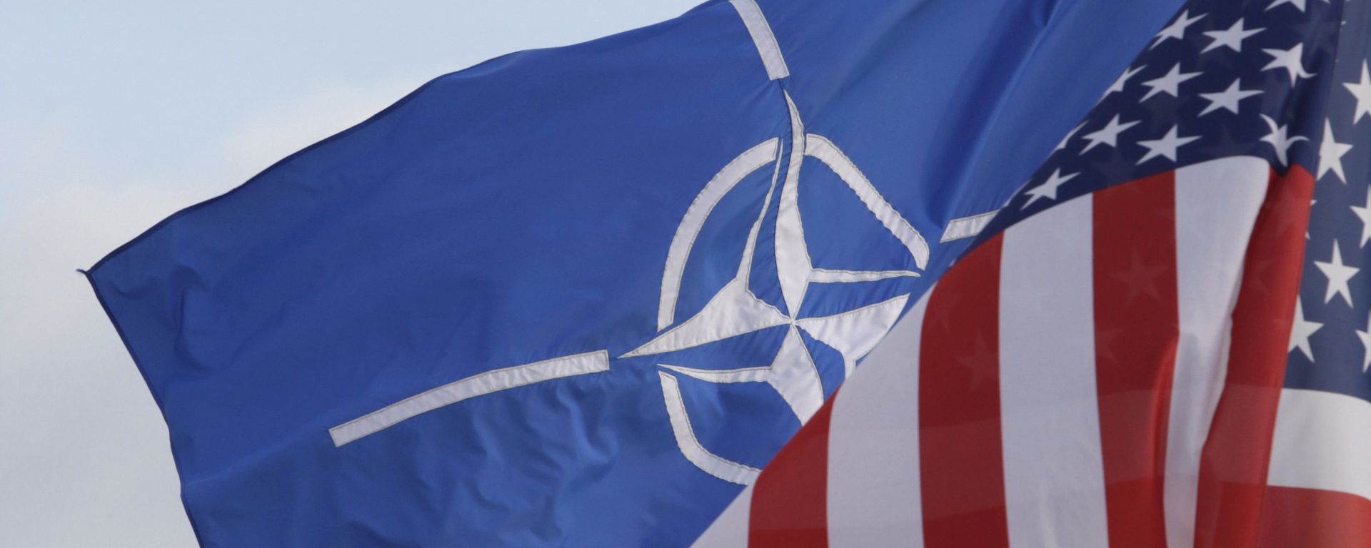 NATO and US flags wave in the wind outside NATO headquarters in Brussels. (File) - Sputnik International, 1920, 27.05.2022