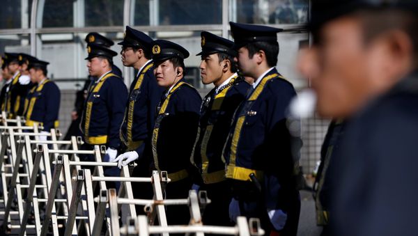 Police officers stand guard near the Russian embassy in Tokyo, Japan December 16, 2016, ahead of the arrival of Russia's President Vladimir Putin in Tokyo Police officers stand guard near the Russian embassy in Tokyo, Japan December 16, 2016, ahead of the arrival of Russia's President Vladimir Putin in Tokyo - Sputnik International