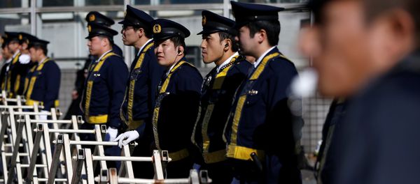 Police officers stand guard near the Russian embassy in Tokyo, Japan December 16, 2016, ahead of the arrival of Russia's President Vladimir Putin in Tokyo Police officers stand guard near the Russian embassy in Tokyo, Japan December 16, 2016, ahead of the arrival of Russia's President Vladimir Putin in Tokyo - Sputnik International