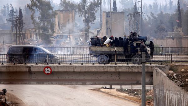 Evacuees from rebel-held eastern Aleppo ride on pick-up trucks along the government-held area of al-Ramousah bridge, Syria December 16, 2016. Evacuees from rebel-held eastern Aleppo ride on pick-up trucks along the government-held area of al-Ramousah bridge, Syria December 16, 2016. - Sputnik International