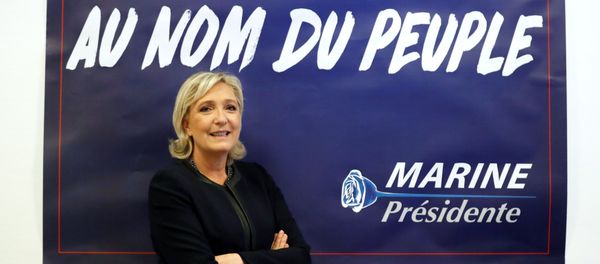 France's far-right National Front (FN) leader Marine Le Pen poses in front of a poster for her 2017 French presidential election campaign as she inaugurates her party campaign headquarters L'Escale in Paris, France, November 16, 2016. France's far-right National Front (FN) leader Marine Le Pen poses in front of a poster for her 2017 French presidential election campaign as she inaugurates her party campaign headquarters L'Escale in Paris, France, November 16, 2016. - Sputnik International