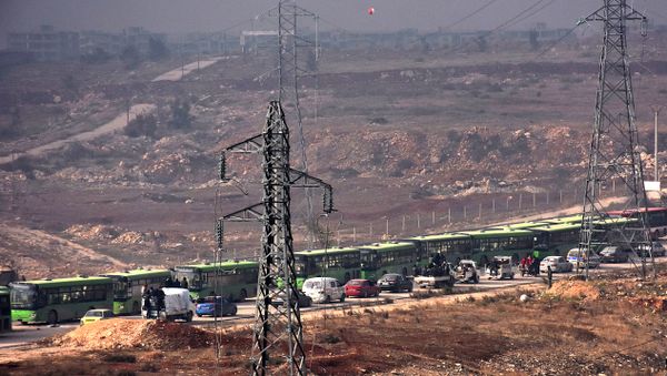 Buses are seen during an evacuation operation of Syrian rebel fighters and civilians from a opposition-held area of Aleppo towards rebel-held territory in the west of Aleppo's province Buses are seen during an evacuation operation of Syrian rebel fighters and civilians from a opposition-held area of Aleppo towards rebel-held territory in the west of Aleppo's province - Sputnik International