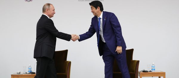 December 16, 2016. Russian President Vladimir Putin and Japanese Prime Minister Shinzo Abe, right, during a joint Russia-Japan business forum in Tokyo. December 16, 2016. Russian President Vladimir Putin and Japanese Prime Minister Shinzo Abe, right, during a joint Russia-Japan business forum in Tokyo. - Sputnik International