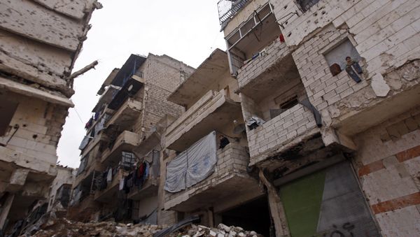 Residents in a government-held part of Aleppo's Salaheddin neighbourhood look out from the balconies of their damaged houses at the road on which the convoy evacuating civilians and rebel fighters from the last rebel-held neighbourhood in the northern Syrian city were supposed to pass Residents in a government-held part of Aleppo's Salaheddin neighbourhood look out from the balconies of their damaged houses at the road on which the convoy evacuating civilians and rebel fighters from the last rebel-held neighbourhood in the northern Syrian city were supposed to pass - Sputnik International