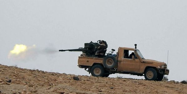 Supporters of the Islamic State militant group on an anonymous photo sharing website, purports to show a gun-mounted vehicle operated by the group firing at Syrian troops north of Palmyra city, in Homs, Syria - Sputnik International