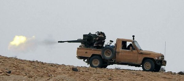 Supporters of the Islamic State militant group on an anonymous photo sharing website, purports to show a gun-mounted vehicle operated by the group firing at Syrian troops north of Palmyra city, in Homs, Syria - Sputnik International