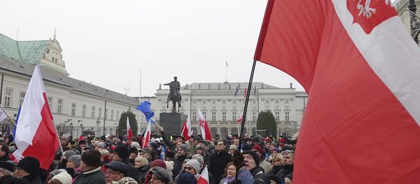 Protesters attend an anti-government demonstration, in Warsaw, Poland Protesters attend an anti-government demonstration, in Warsaw, Poland - Sputnik International