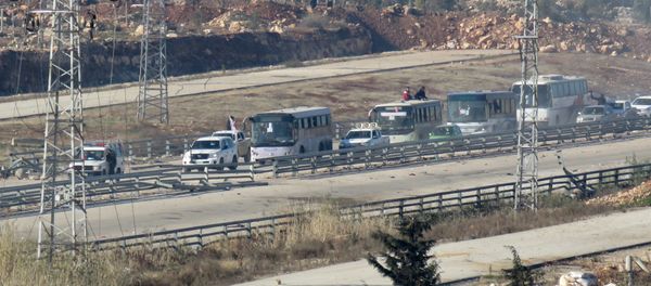 Four buses, with on board people who are evacuated from Fuaa and Kafraya (two under rebel siege Shiite villages), arrive at the Syrian government-controlled crossing of Ramoussa, on the southern outskirts of Aleppo, on December 19, 2016 during an evacuation operation of rebel fighters and civilians from rebel-held areas Four buses, with on board people who are evacuated from Fuaa and Kafraya (two under rebel siege Shiite villages), arrive at the Syrian government-controlled crossing of Ramoussa, on the southern outskirts of Aleppo, on December 19, 2016 during an evacuation operation of rebel fighters and civilians from rebel-held areas - Sputnik International