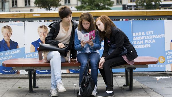 Three young swedish girls read an election bulletin of the Feminist Initiative party Three young swedish girls read an election bulletin of the Feminist Initiative party - Sputnik International